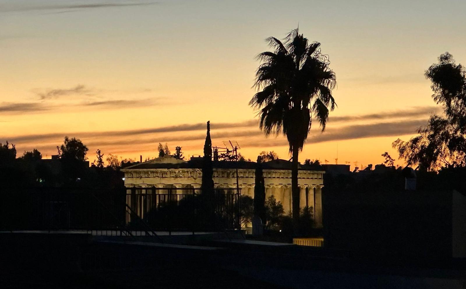 Sunset over a building in Athens