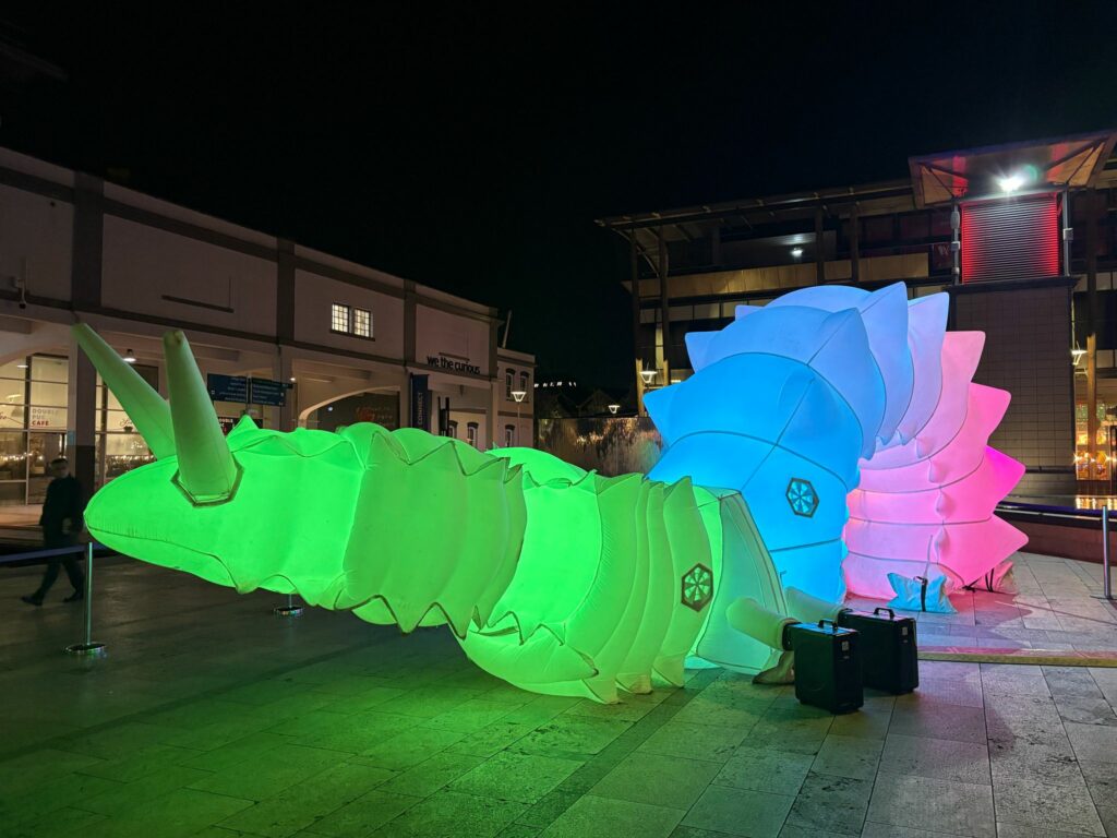 Giant inflatable snail Luma at night in Bristol